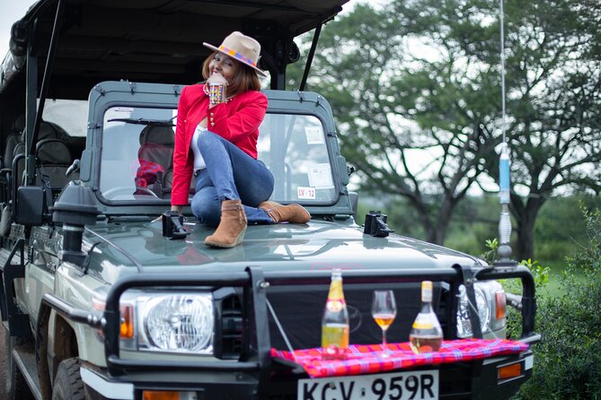 Nairobi National Park Game Drive - Shared Experience in Open Jeep - Photography with skyscrapers behind the animals