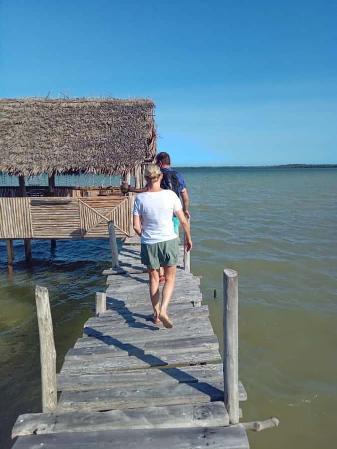 Watamu: Sunset Mangrove Canoe Tour with Coconut Drink - Walking across the mudflats at low tide